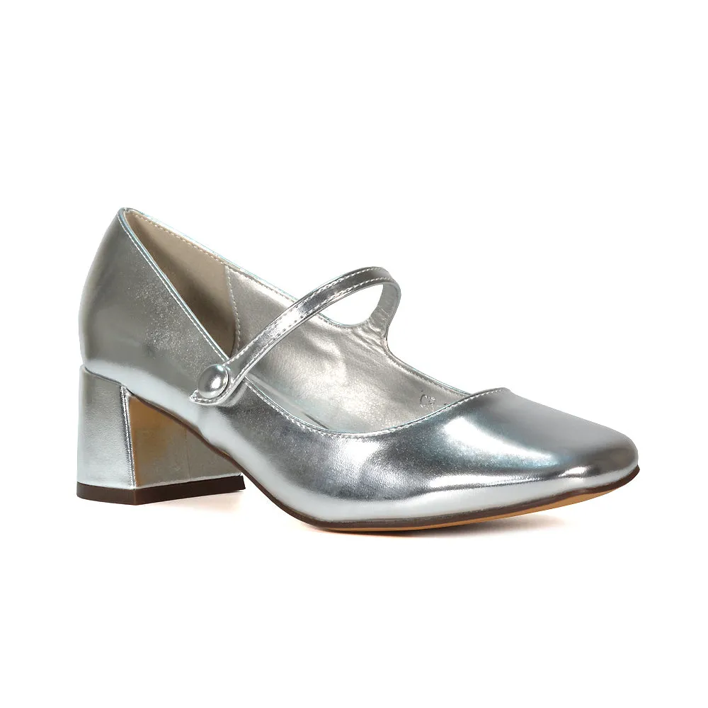 Rhea Mid Block Heel Closed Toe Mary Jane Shoes With Strap in Black Patent