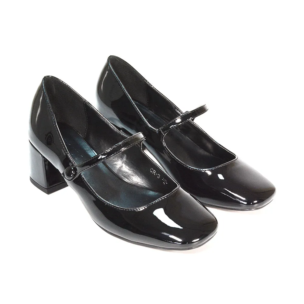 Rhea Mid Block Heel Closed Toe Mary Jane Shoes With Strap in Black Patent