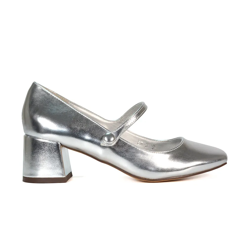 Rhea Mid Block Heel Closed Toe Mary Jane Shoes With Strap in Black Patent