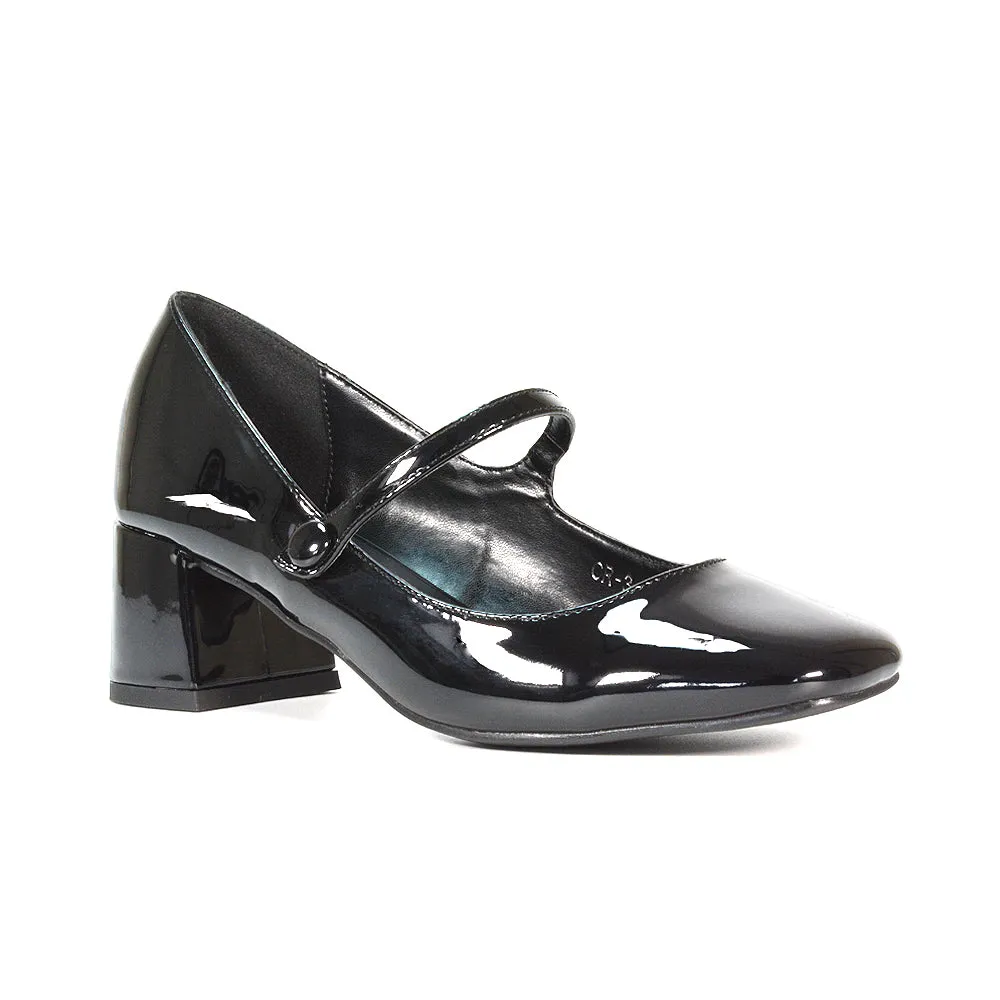 Rhea Mid Block Heel Closed Toe Mary Jane Shoes With Strap in Black Patent
