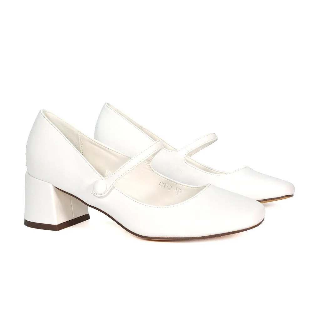 Rhea Mid Block Heel Closed Toe Mary Jane Shoes With Strap in Black Patent