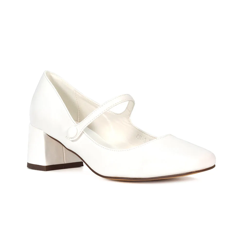 Rhea Mid Block Heel Closed Toe Mary Jane Shoes With Strap in Black Patent