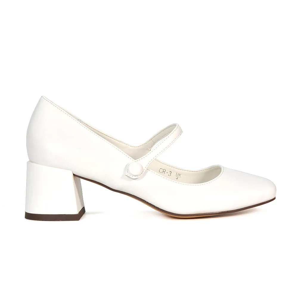 Rhea Mid Block Heel Closed Toe Mary Jane Shoes With Strap in Black Patent