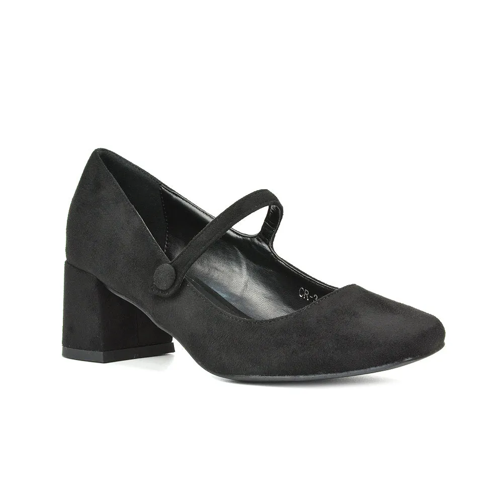 Rhea Mid Block Heel Closed Toe Mary Jane Shoes With Strap in Black Patent