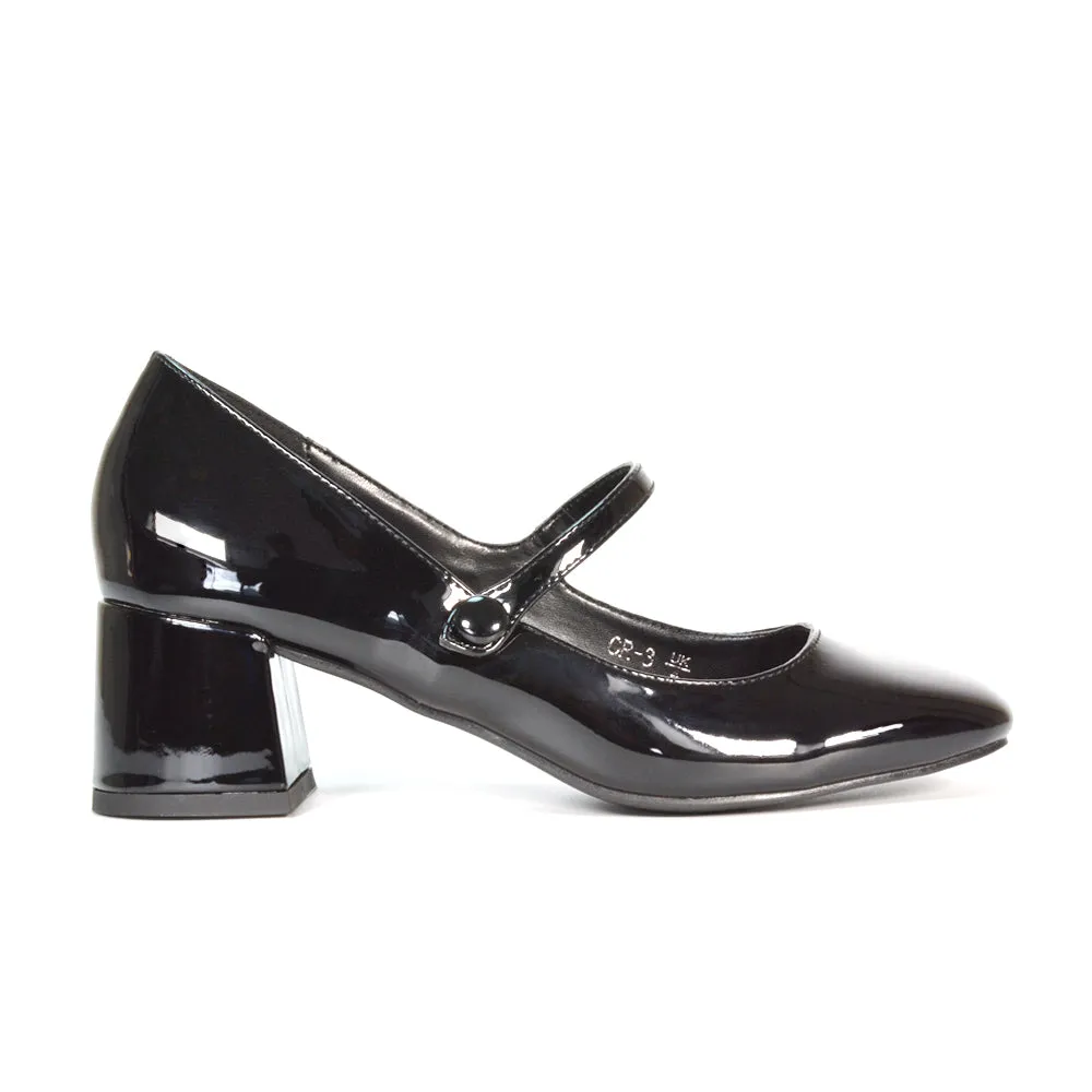 Rhea Mid Block Heel Closed Toe Mary Jane Shoes With Strap in Black Patent